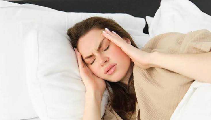 Woman resting in bed